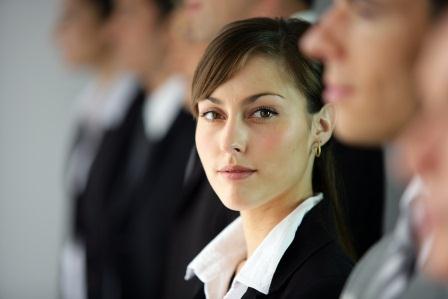 Here comes author rank - Young woman standing in line with coworkers